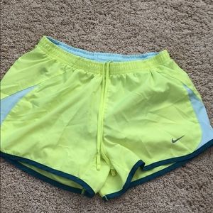 Bright yellow Nike running shorts